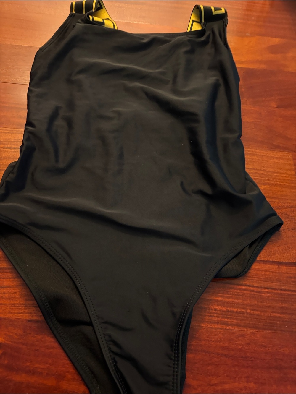 Black One-Piece Bodysuit with Yellow-Accent Straps